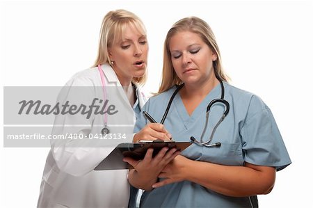 Two Doctors or Nurses Looking over File on Clipboard Isolated on a White Background.