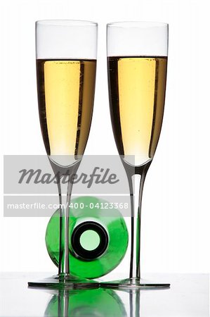 Two champagne glasses and a bottle in silhouette