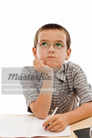 Schoolboy doing bored his homework - isolated