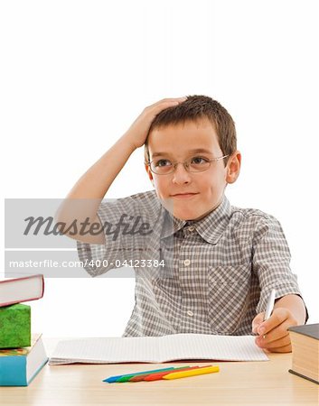 Schoolboy thinking about his homework - isolated