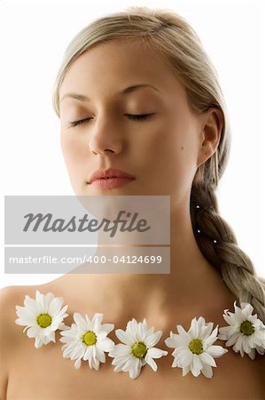 closed eyes portrait of a beautiful woman with twist braid and a flowers necklace