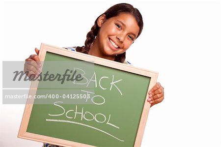 Pretty Hispanic Girl Holding Chalkboard with Back To School Isolated on a White Background.