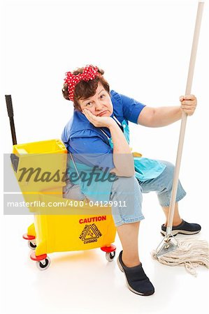 Tired unhappy cleaning lady sitting in her mop bucket.  Isolated on white.