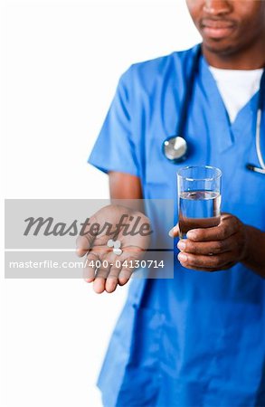 Confident Afro-American doctor holding pills and glass of water in front of the camera