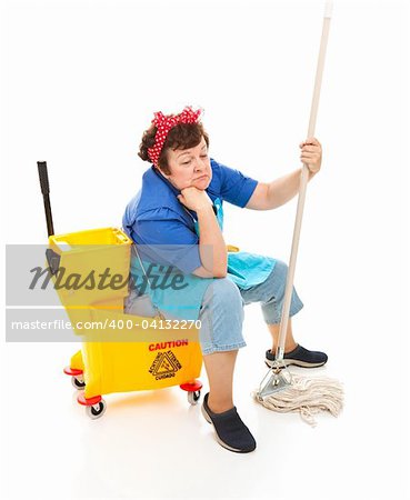 Depressed maid sitting in her bucket and holding her mop, with a sad expression on her face.  Full body isolated.