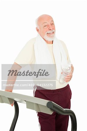 Handsome senior man on the treadmill with bottled water.  Isolated on white.