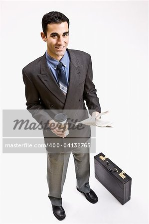Businessman with coffee and newspaper