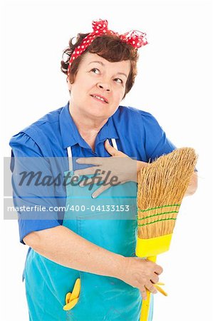 Attractive middle aged housekeeper fantasizes about a better life.  Isolated on white.