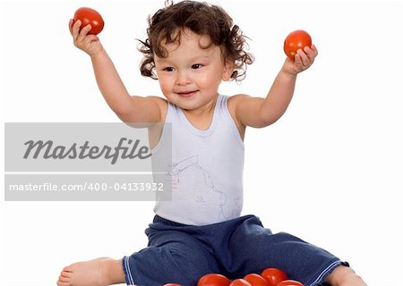 Child with tomato, isolated on a white background.