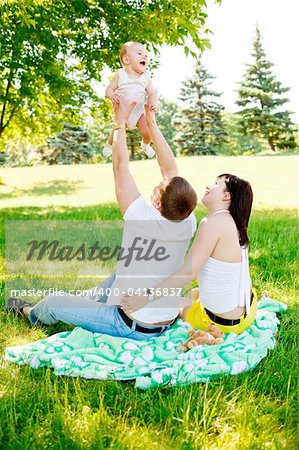 Young family in park at the weekend