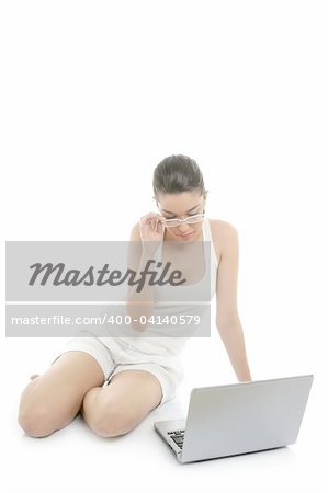 Beautiful woman working laptop on the white floor at studio