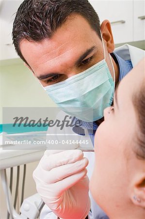 young male dentist at work