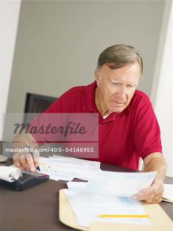 Senior man checking home finances. Copy space