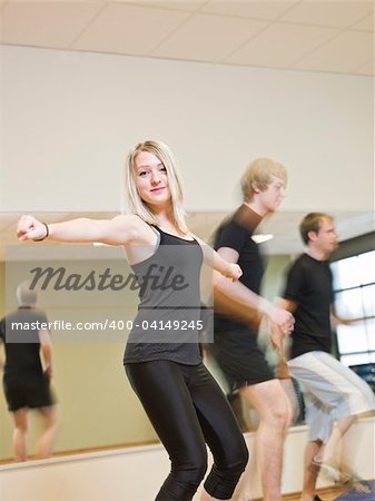 Group of people doing step up with a girl in focus