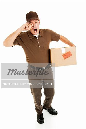 Tired, overworked delivery man rubbing his eyes and yawning.  Full body isolated.
