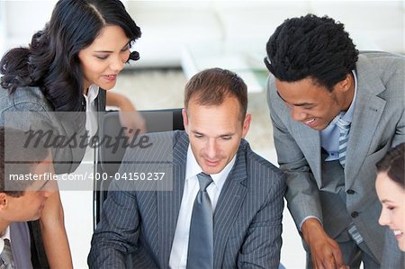 Male manager working with his businessteam in office