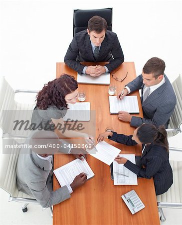 High Angle of multi-ethnic business people working together in a meeting