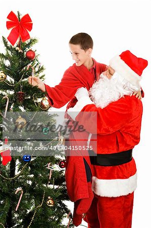 Santa lifting adorable little boy to take a candy cane off the Christmas tree.  White background.