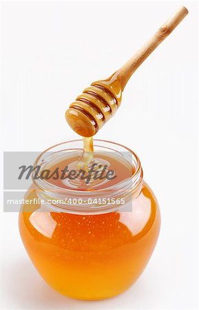 Full honey pot and honey stick