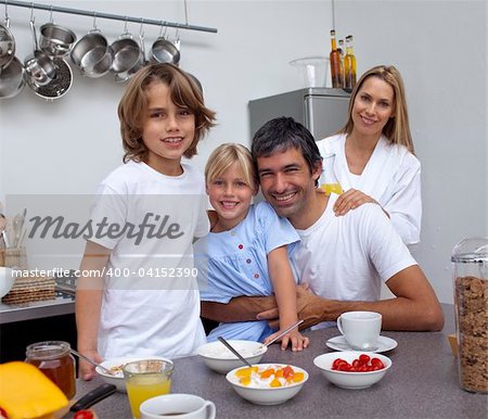 Family having breakfast together in the kitchen