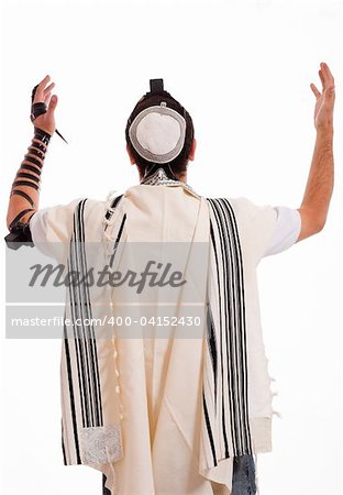 Rear view of jewish men put phylactery on isolated background