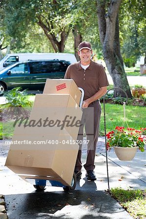 Delivery man or mover bringing boxes up your front walk.