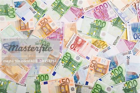 European currency banknotes scattered on the table, top view - background