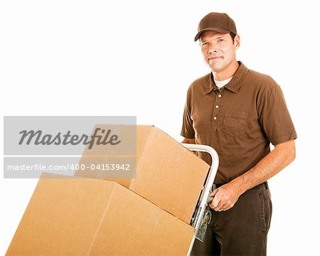 Handsome moving man moves a stack of boxes on his dolly.  Isolated on white.
