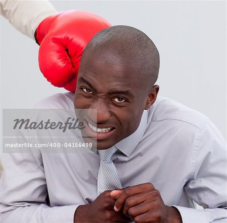 Portrait of an Afro-American businessman being boxed in the office