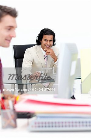 Two smiling businessmen working in the office. Business concept.