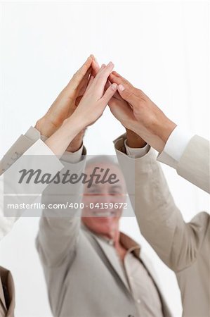 Senior manager and his team clebrating a success against a white background
