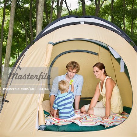 Family sitting in tent