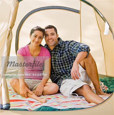 Couple sitting in tent