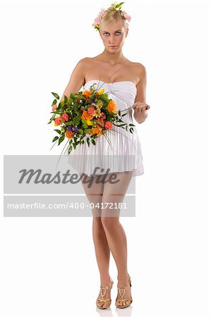 young beautiful girl with a white sexy dress with flowers and bouquet as a spring woman