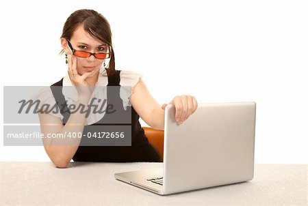 Pretty female office worker with laptop computer