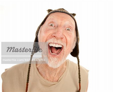 Laughing senior man on white background in knit cap