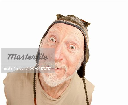 Confused senior man on white background in knit cap
