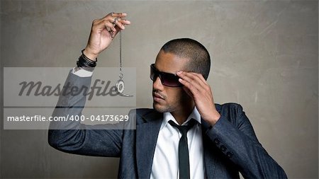 Business man looks at the time on his watch