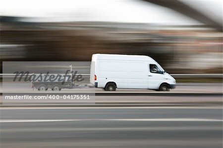 White work van speeding along the motorway