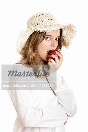 Portrait of a beautiful young woman eating a red apple