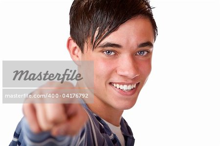 Close-up of teenager pointing with finger on camera. Isolated on white.