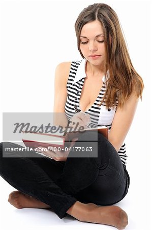 Beautiful girl doing homework on a white background