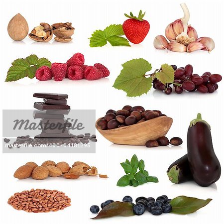 Healthy food collection very high in antioxidants and vitamins, isolated over white background.