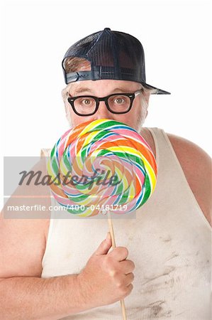 Large man in tee shirt with lollipop on white background