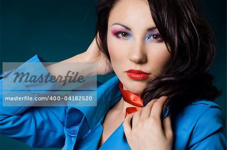 Sexy fashionable woman in blue jacket