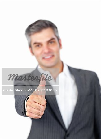 Mature businessman with thumb up against a white background