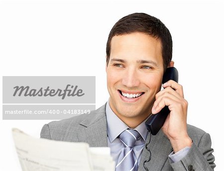 Positive businessman on phone holding a newspaper against a white background
