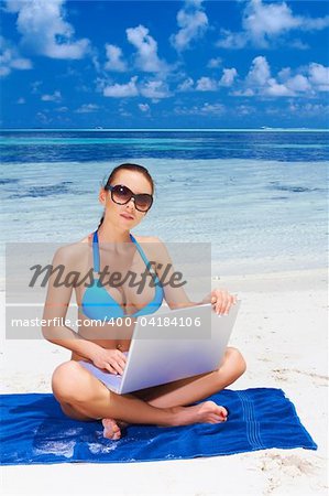 Beautiful woman resting near water at Maldives