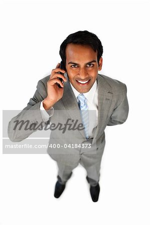 Positive ethnic businessman on phone isolated on a white background