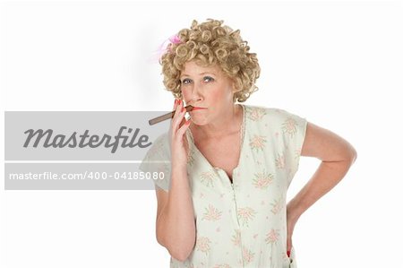Housewife with cigar and hands on hips on white background